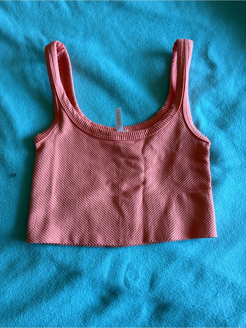 Nikibiki Ribbed Cropped Tank in Coral Pink